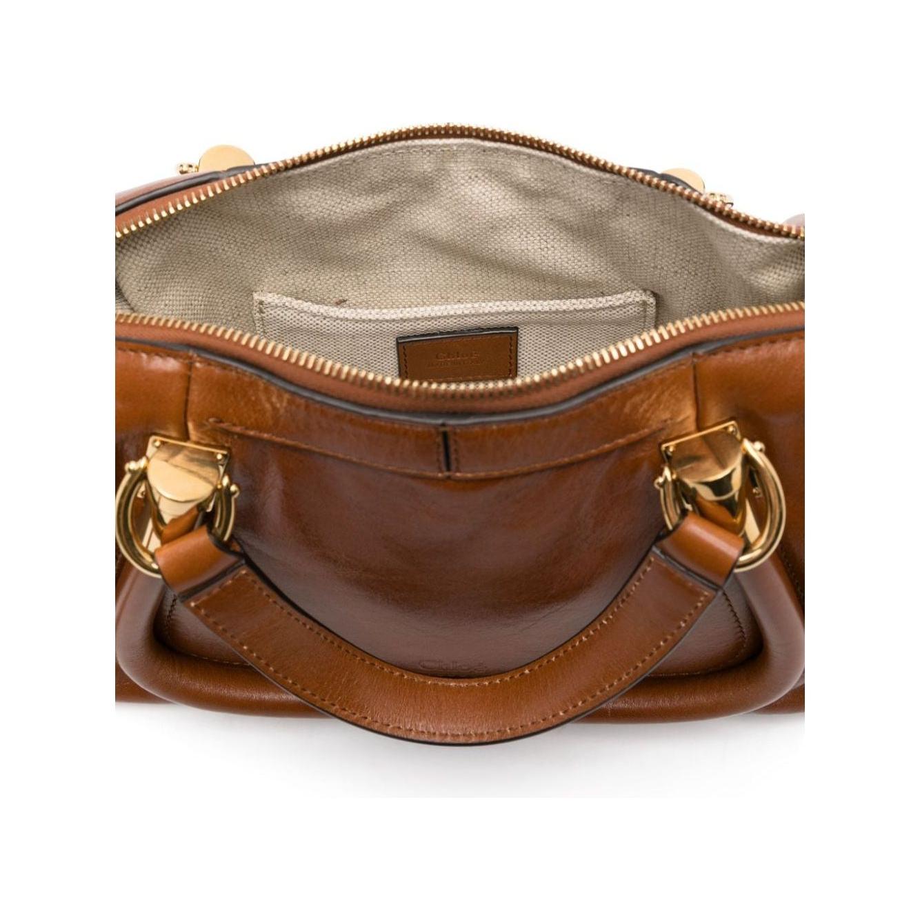 Front view with bag zipped and handles upright.