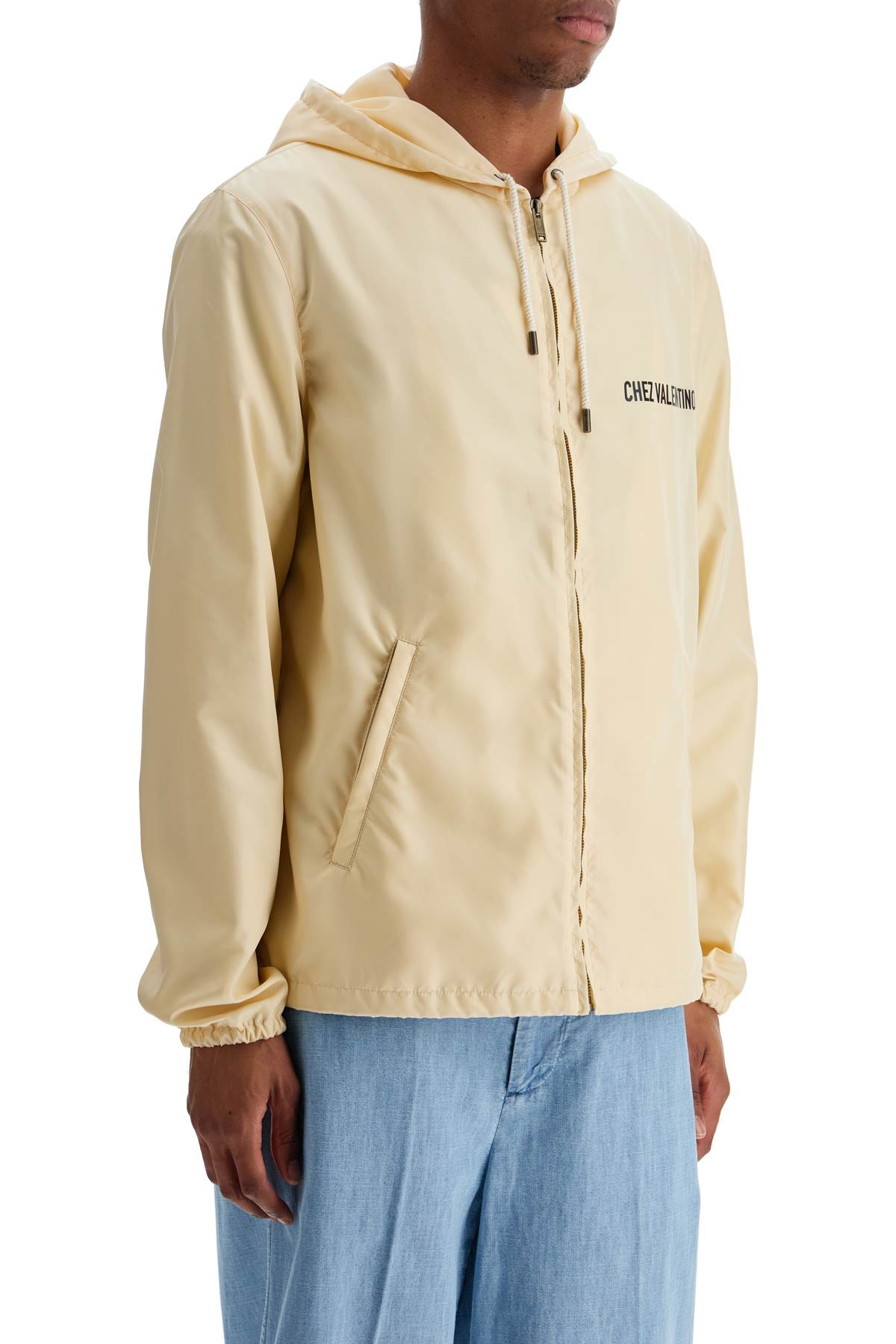 Valentino Garavani beige hooded windbreaker in logoed polyamide Jackets Valentino Garavani